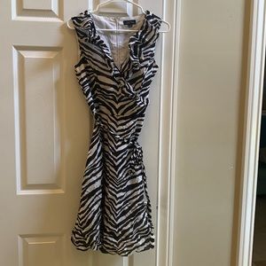 Never worn Tahiti sleeveless black and white zebra stripes lined dress. Size 6
